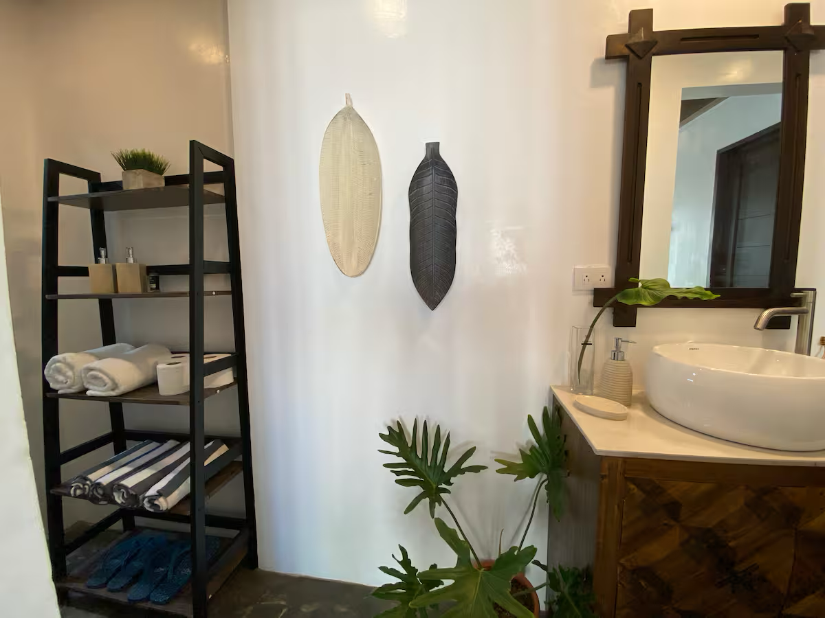 Toilet and bath at Ysla Villa